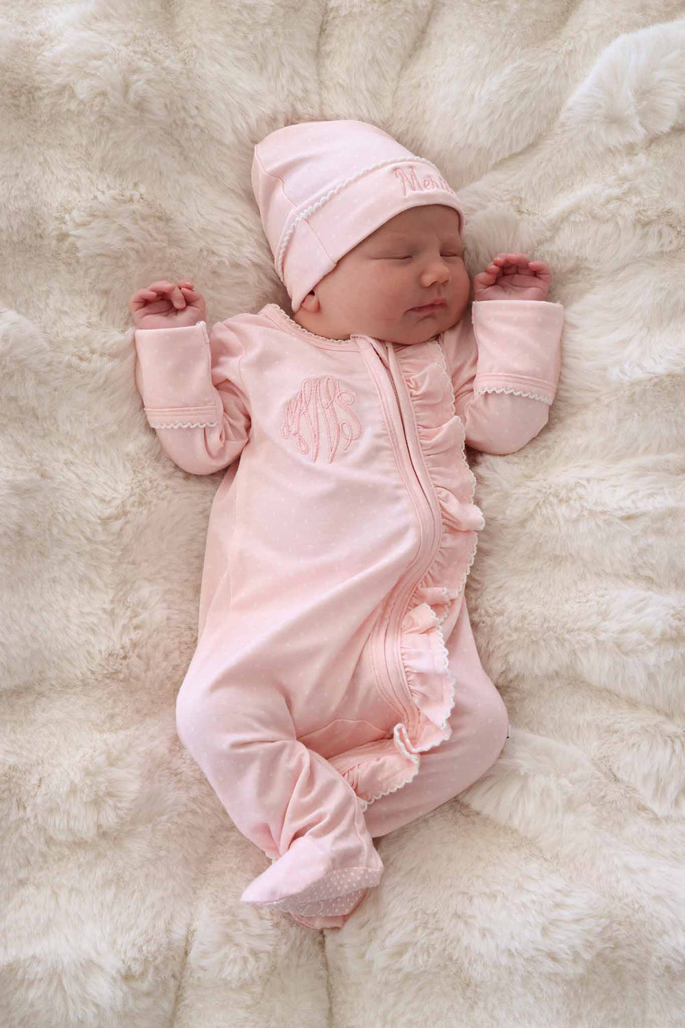 newborn in pink picot trim bamboo zipper footie