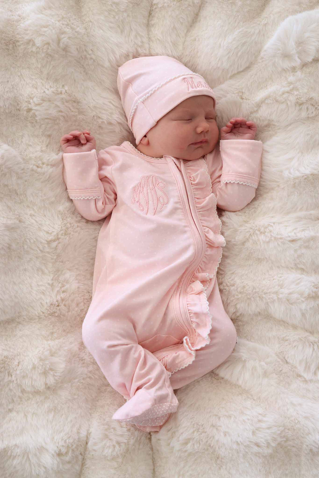 newborn in pink picot trim bamboo zipper footie