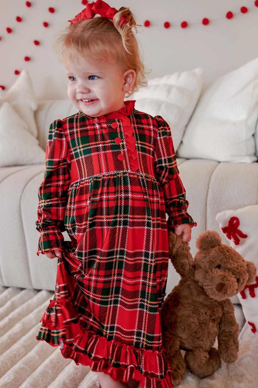 Caden Lane toddler girls' Christmas bamboo dress in a classic red and green plaid print with ruffle details, perfect for holiday photos, Christmas celebrations, and matching family pajamas.