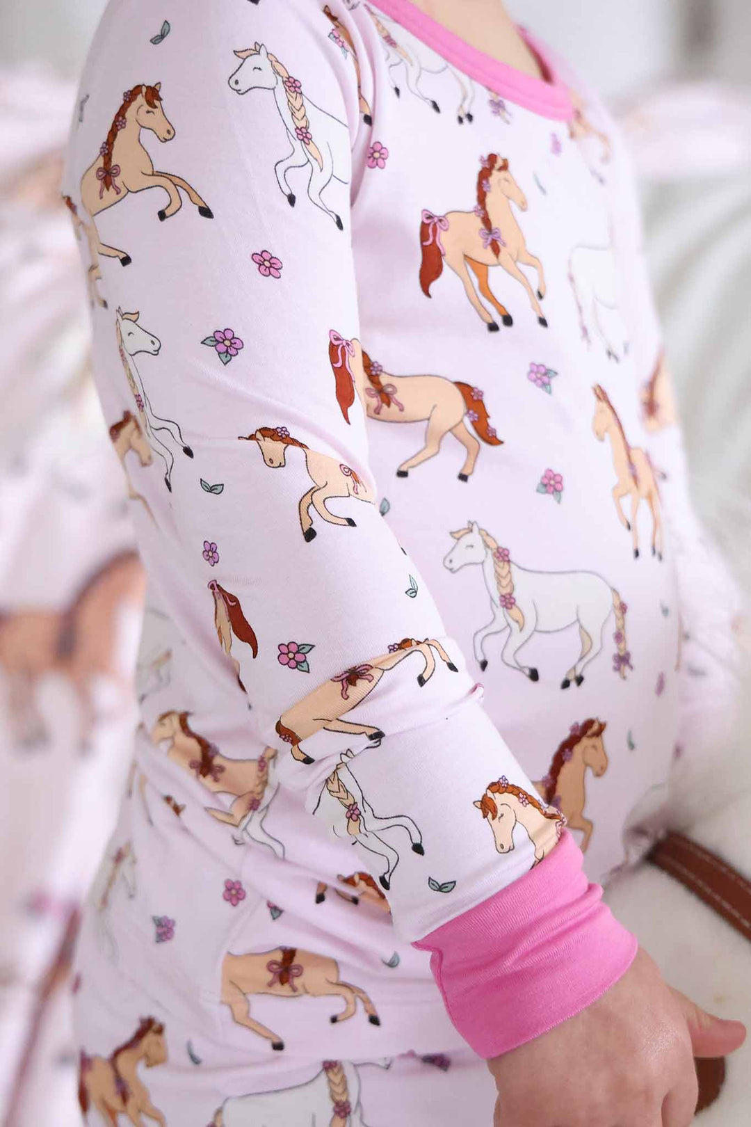 closeup of pony club pink two piece pajama set for girls 