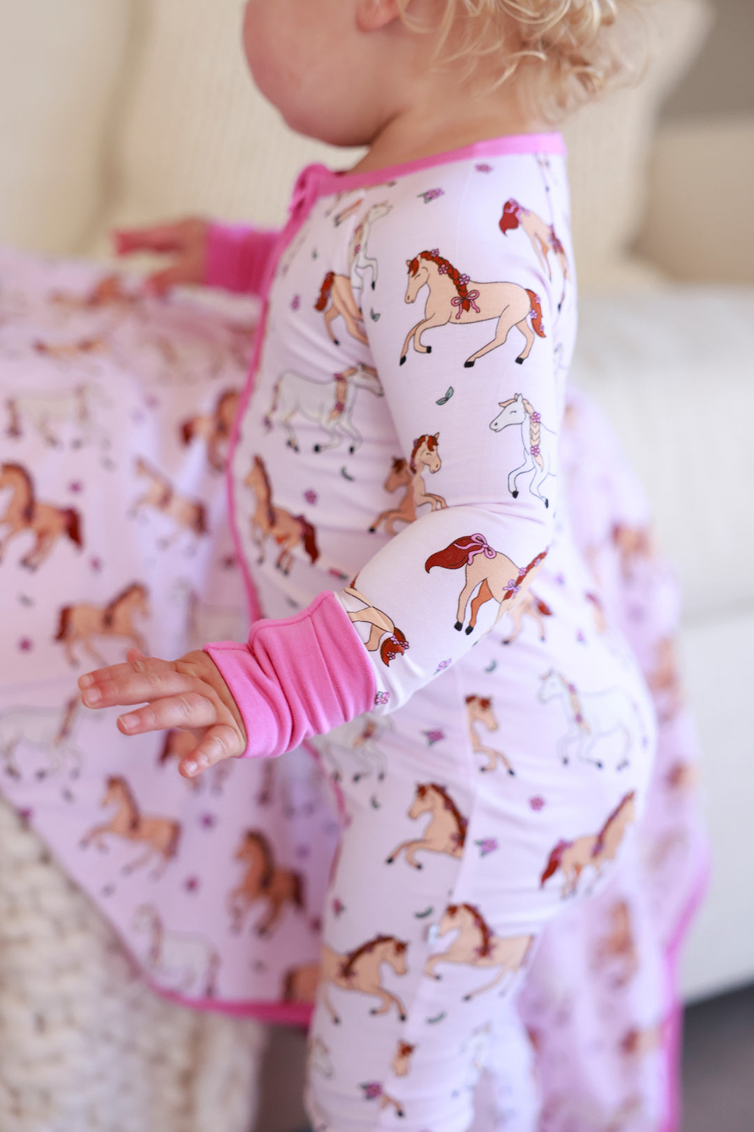 side view of pony club pink convertible zip romper 