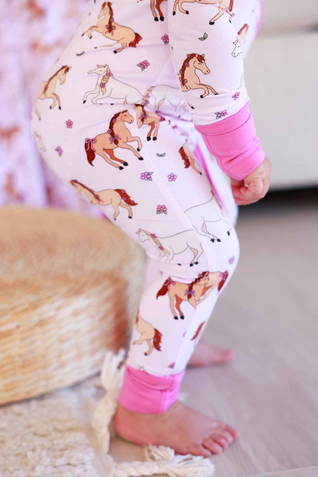 closeup of pony club pink girly horse and flower convertible zip romper for girls 