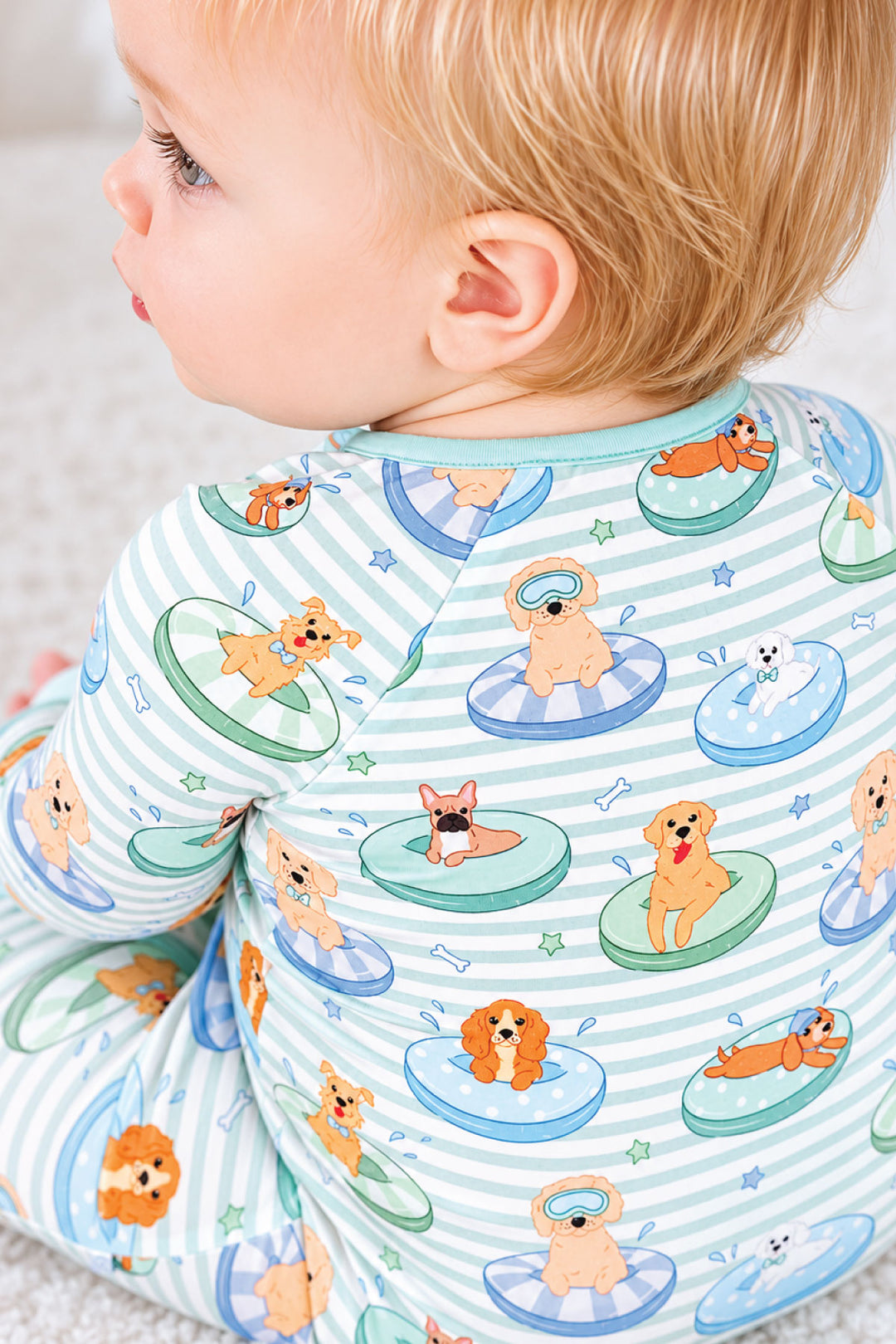 closeup of blue poolside pups zip romper