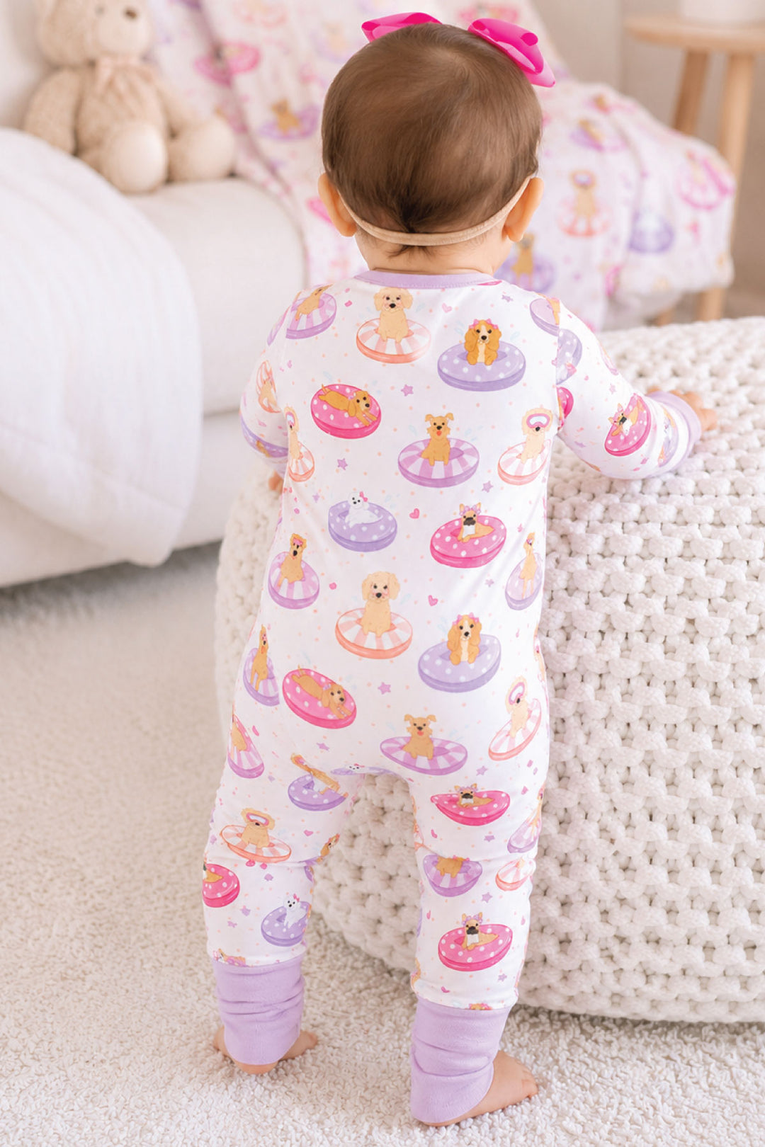 girl toddler pajama romper dogs on pool floaties