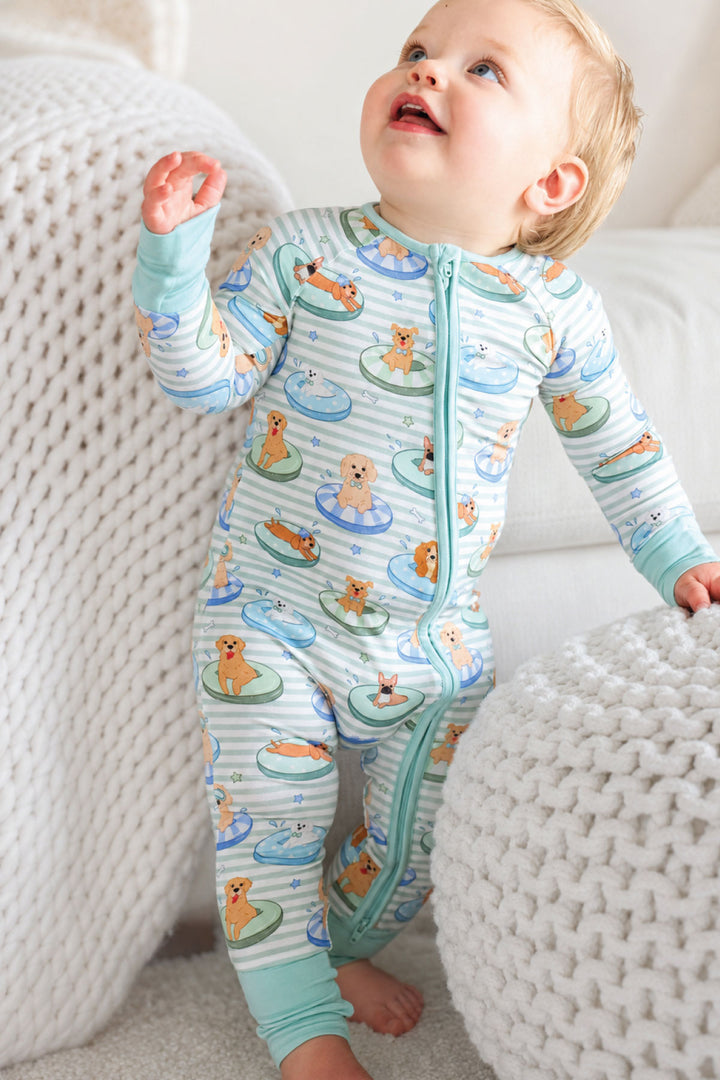 standing toddler boy in poolside pups bamboo viscose zip romper pajama 
