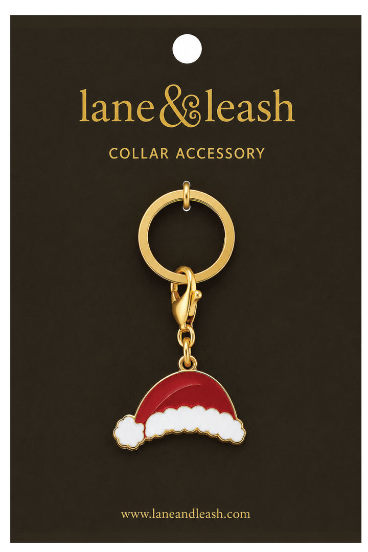 Lane & Leash Santa hat charm collar accessory on branded packaging card, gold ring with lobster clasp and enamel red-and-white Santa hat charm