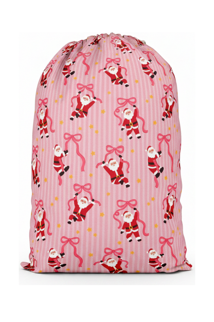 Caden Lane Jolly Ribbons Personalized Christmas Santa Sack back featuring an exclusive Santa and ribbon print on pink stripes, coordinating with matching family pajamas and holiday accessories.