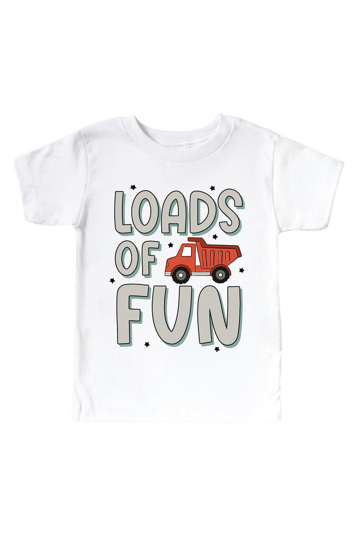 Flat lay of a Caden Lane white short-sleeve tee in a Busy Builder print featuring a red dump truck and tiny stars, reading "Loads of fun" in bold gray letters.