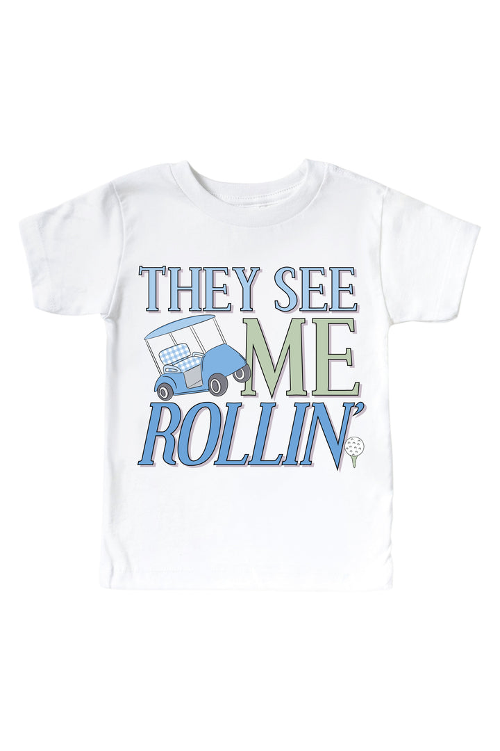 blue they see me rollin' golf graphic kids tee in white, caddie crew, flat lay
