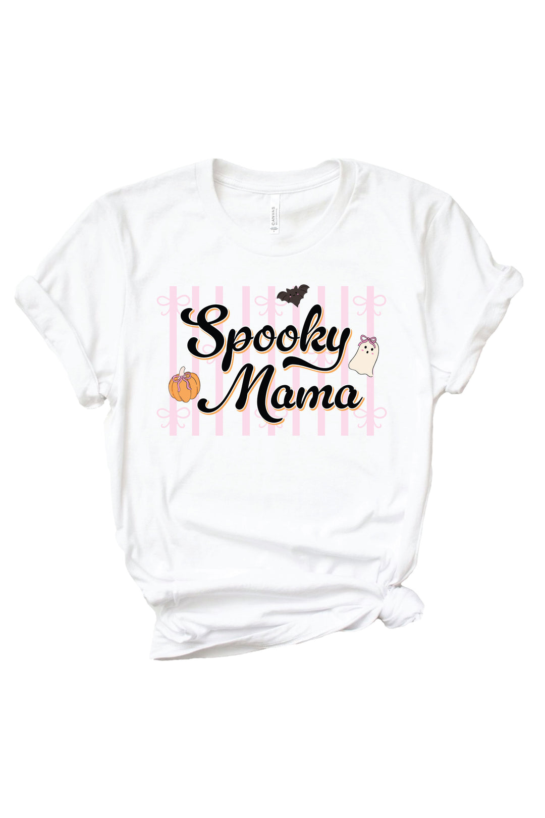 White Caden Lane t-shirt with 'Spooky Mama' script text over a pink striped background, decorated with a cute bat, ghost, and pumpkin with bows.
