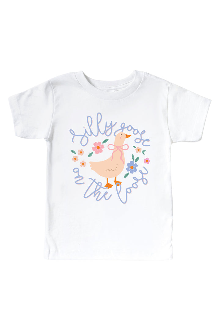 White kids graphic tee mockup with Silly Goose On The Loose graphic featuring a goose surrounded by flowers and script text on a white background