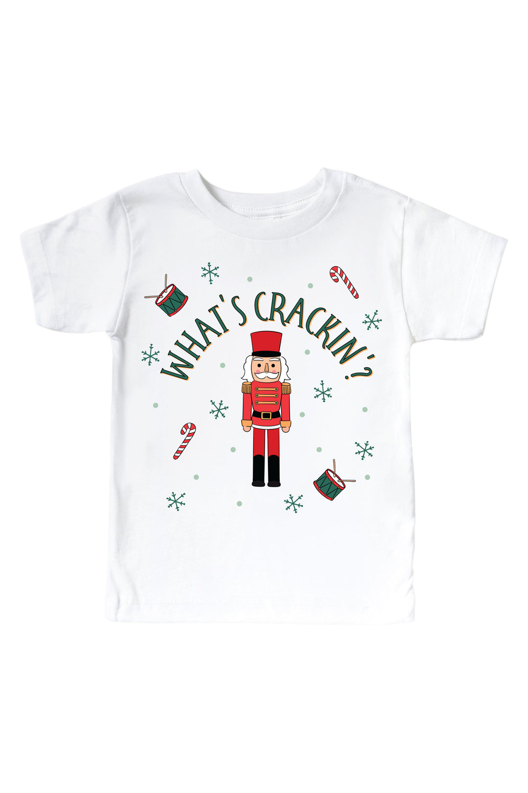 Caden Lane's white "What's Crackin'" toddler t-shirt featuring a red and green toy soldier nutcracker with snowflakes, candy canes, and drums, laid flat.