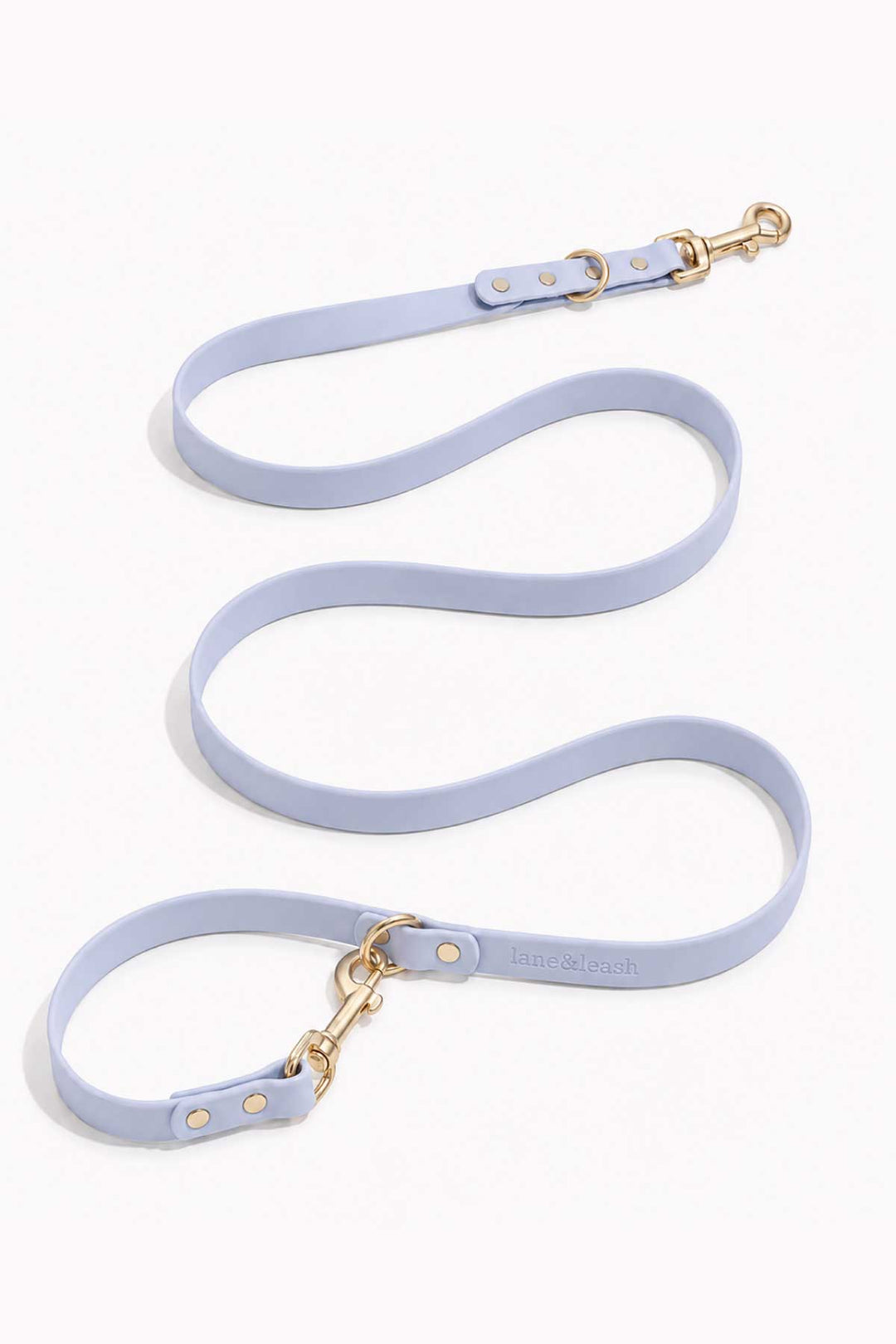 Waterproof silicone dog leash in cloud blue, showing full length with gold snap hook clasp and loop handle