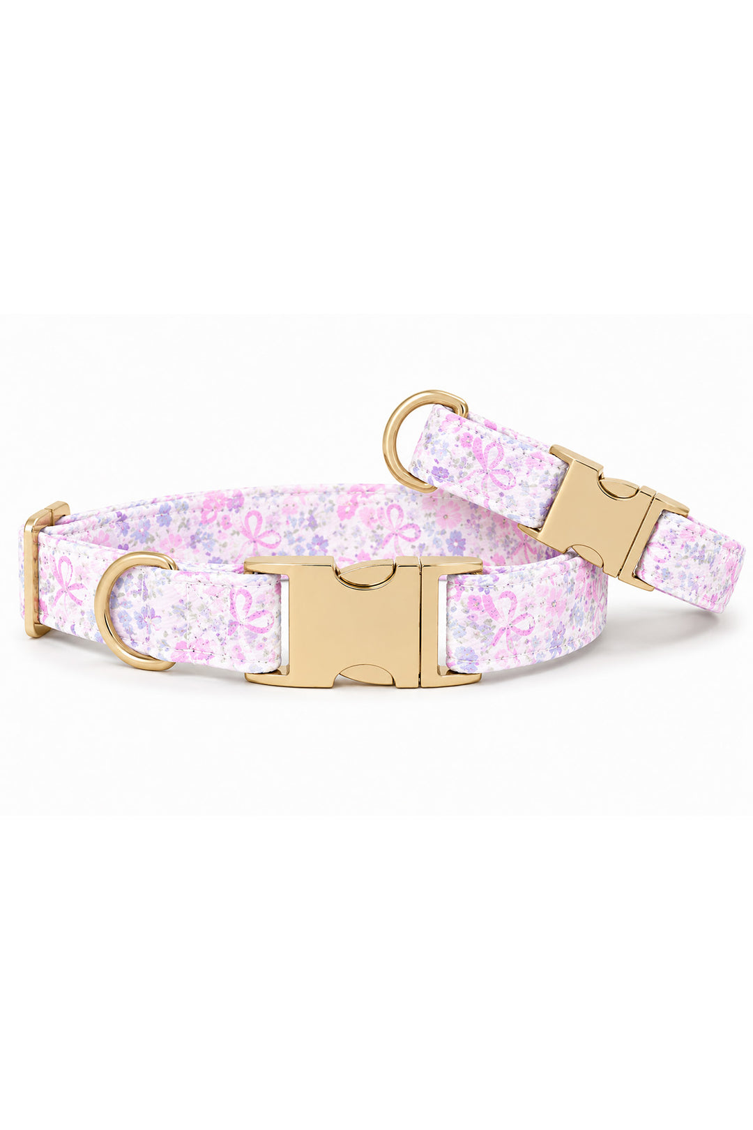 Two Ribbon Garden dog collars in different sizes stacked together, showing the pink and lavender floral print with gold quick-release buckles on white background