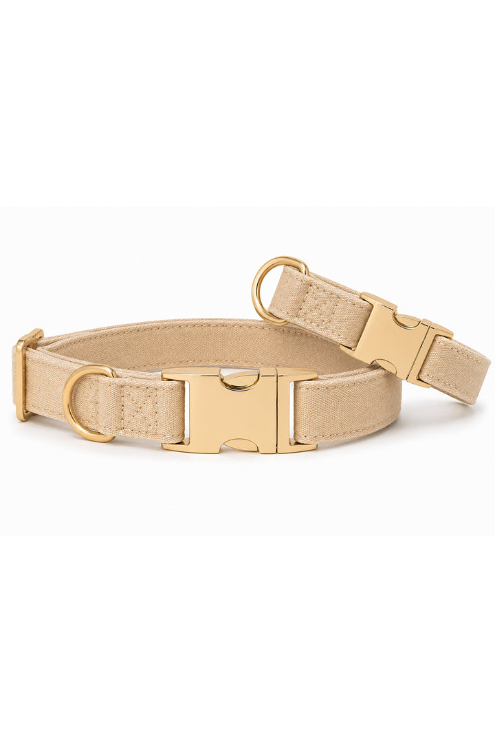 Caden Lane sand dune beige flax fabric dog collar shown at angle revealing padded interior and gold side-release buckle