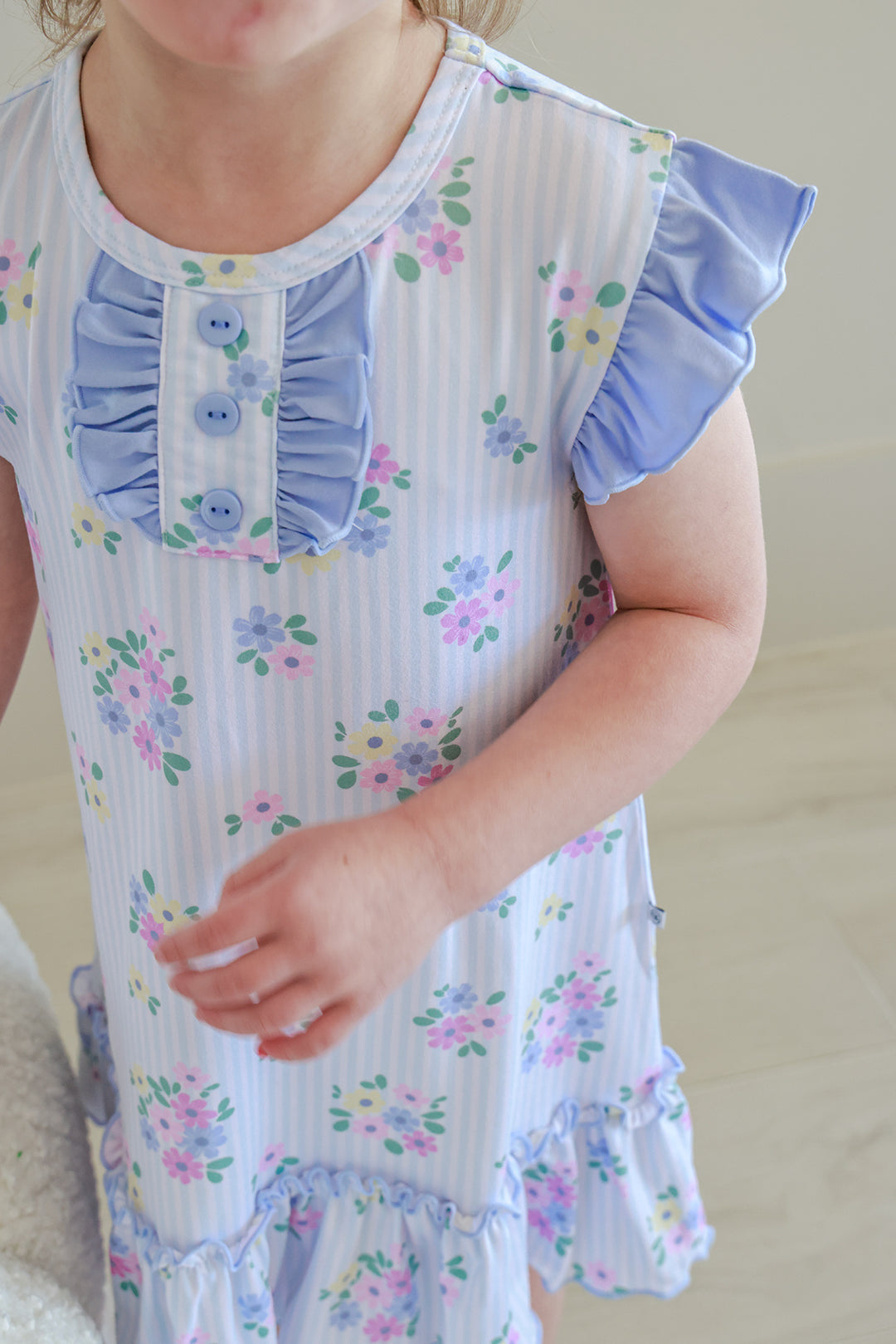 Close-up of Flutter Sleeve Nightgown in Heirloom Posies showing ruffled button collar detail, flutter sleeve and pink and blue floral print