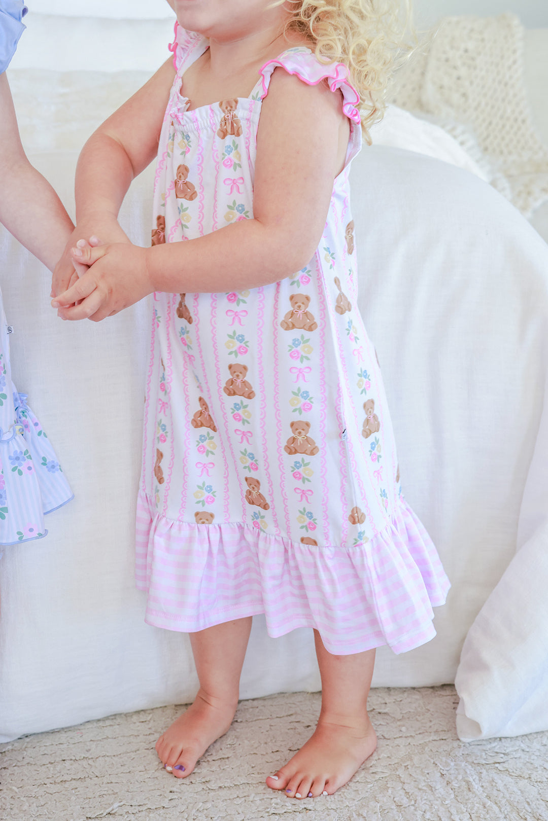 Young girl wearing Full Length Ruffle Nightgown in Beary Lovely print, body view showing teddy bear and floral stripe pattern with pink gingham ruffle hem