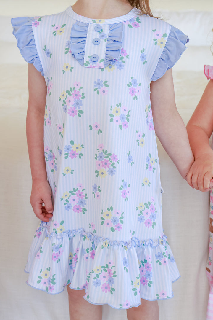 Body view of Flutter Sleeve Nightgown in Heirloom Posies showing ruffled collar with buttons, blue flutter sleeves, floral print and ruffle hem detail