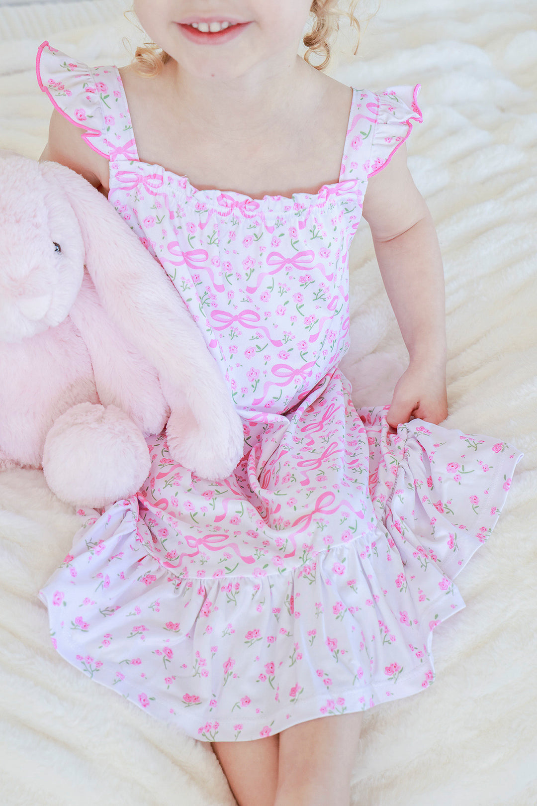 Young girl wearing Full Length Ruffle Nightgown in Dreamy Bows print, cheerful expression, full body standing pose