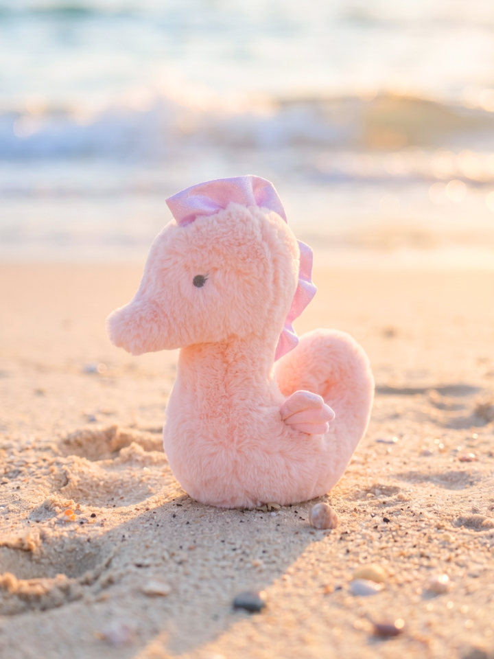 large cuddle plush seahorse stuffed animal at the beach — summer ocean stuffed animal for kids
