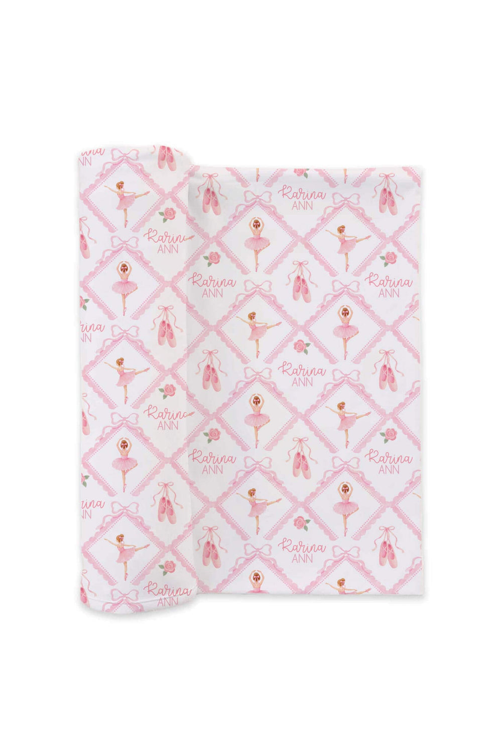 Folded Caden Lane ballerina and roses pink print personalized swaddle embroidered with the name 'Karina Ann,' flat lay on a white background