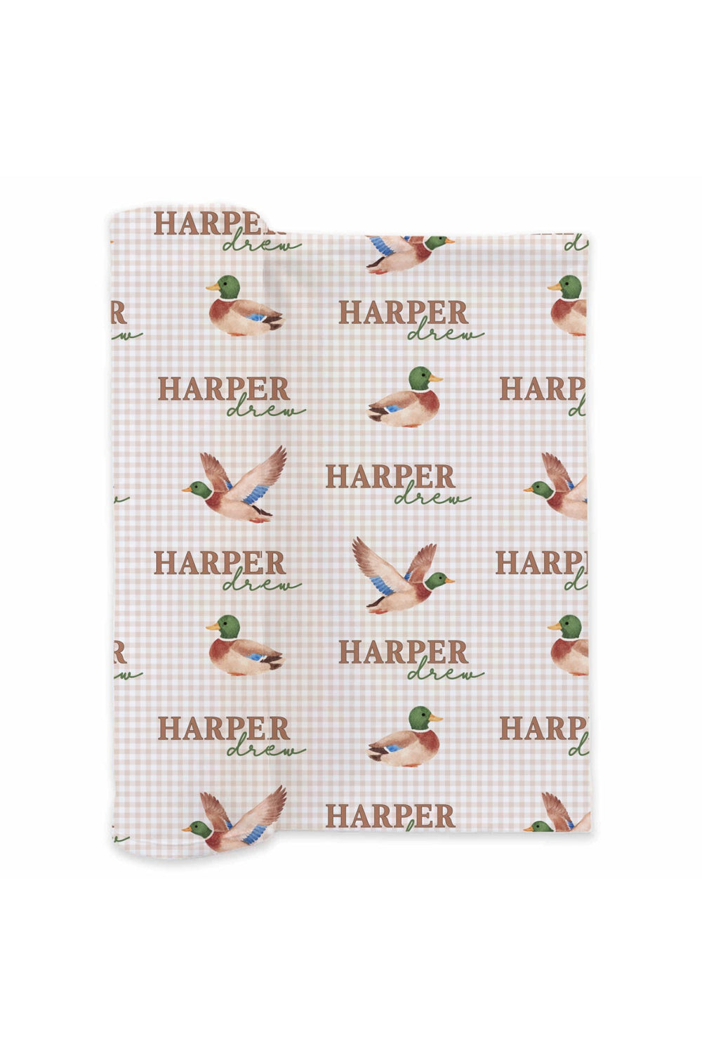 Flat lay of personalized little mallard duck print swaddle blanket showing full repeating name and flying duck pattern