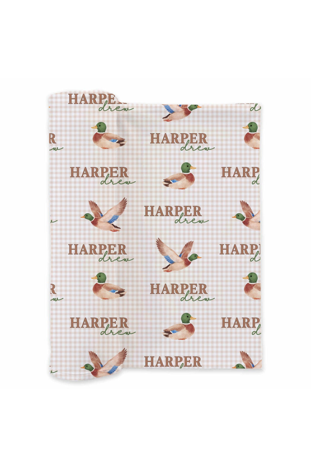 Flat lay of personalized little mallard duck print swaddle blanket showing full repeating name and flying duck pattern