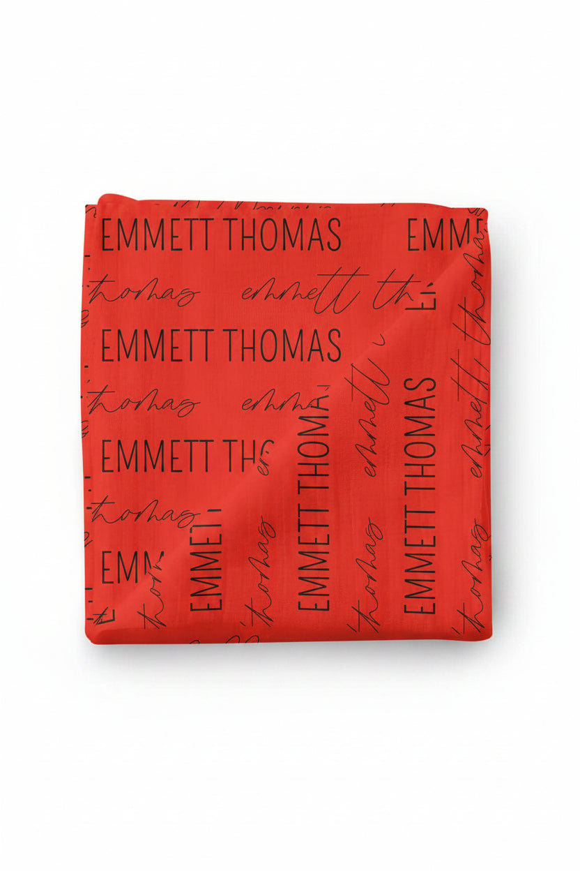 block and script baby name swaddle blanket red and black
