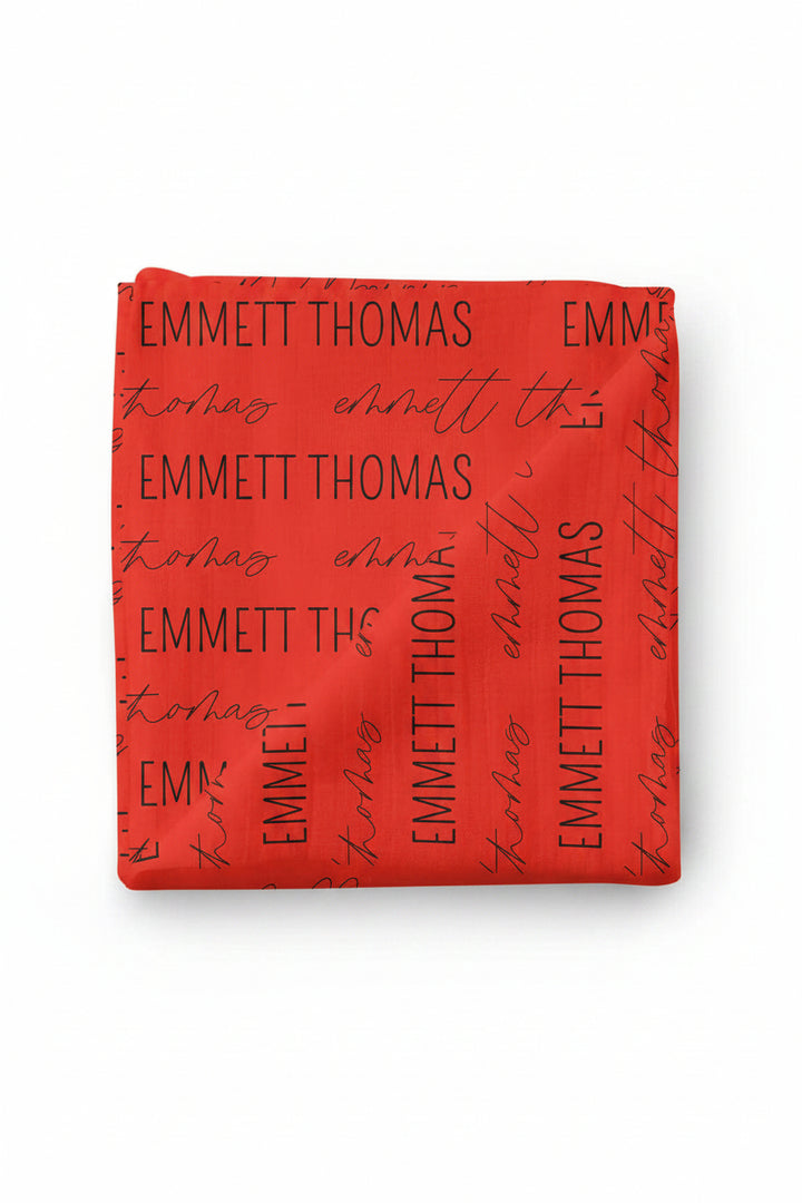block and script baby name swaddle blanket red and black