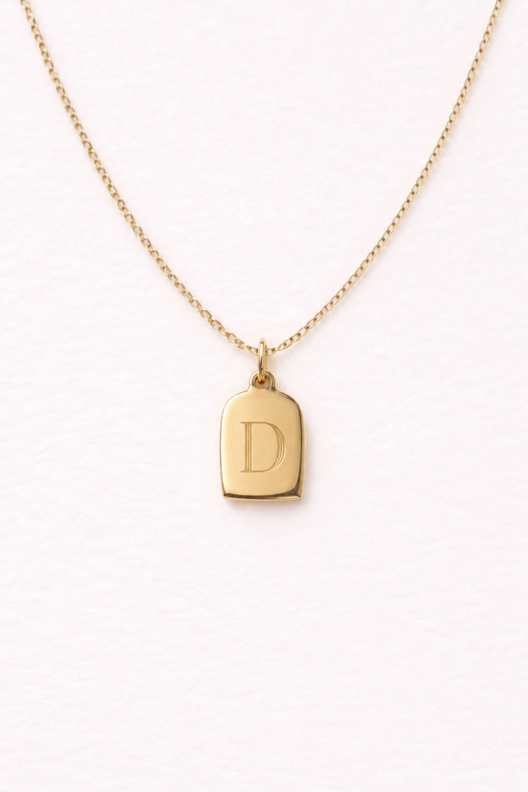 Caden Lane gold necklace with engraved initial "D" tag charm pendant