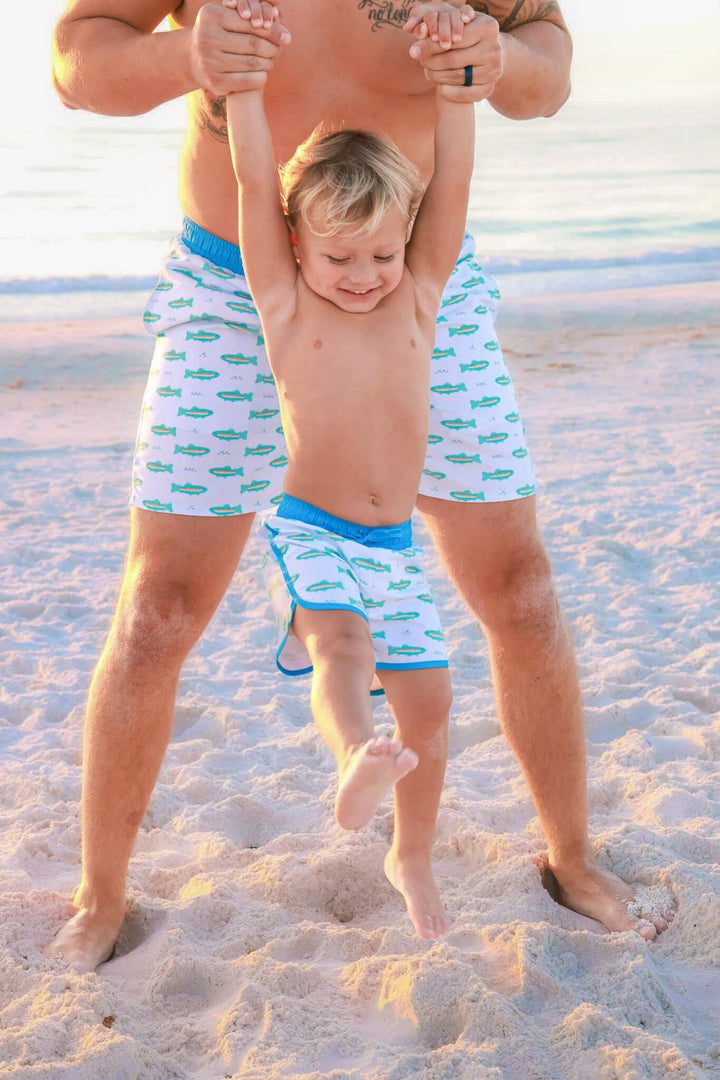 dad and son swim trunks with trout print 