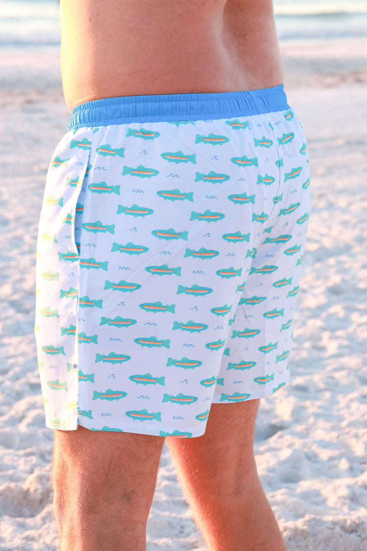 closeup of tiny trout men's swim trunks 