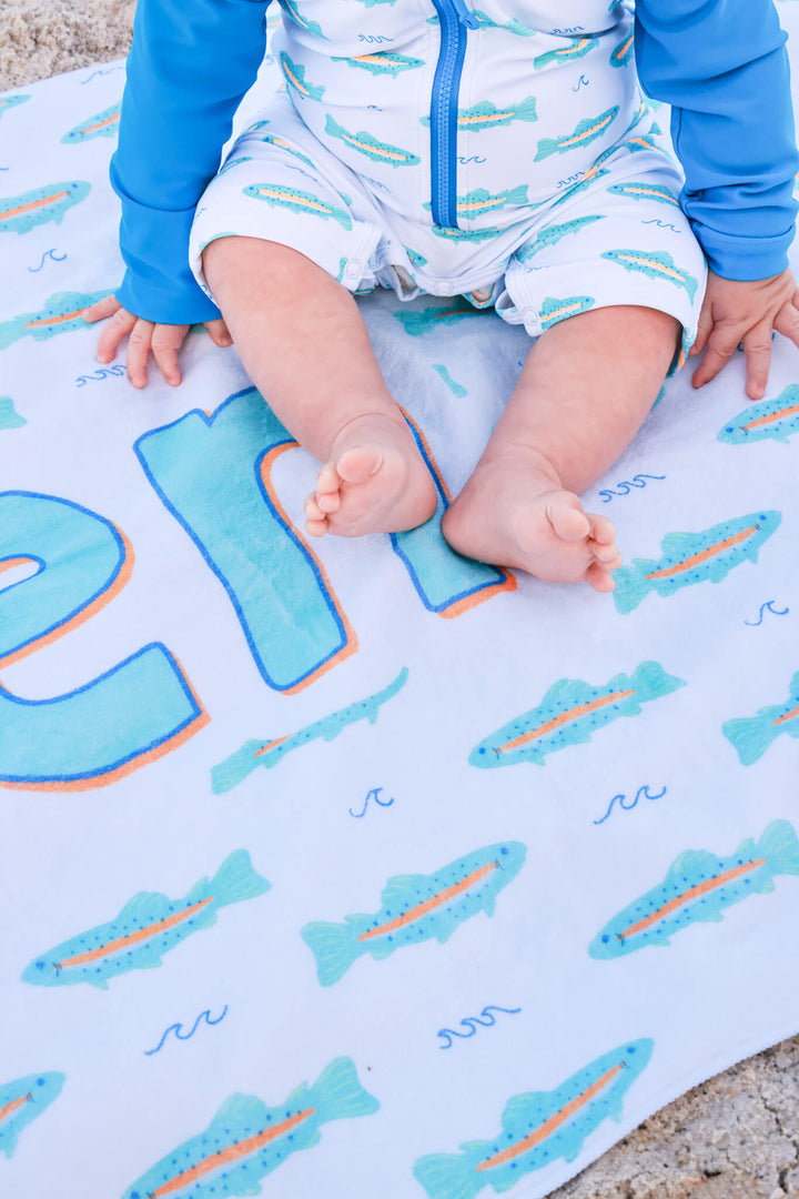 closeup of tiny trout personalized beach towel for boys 