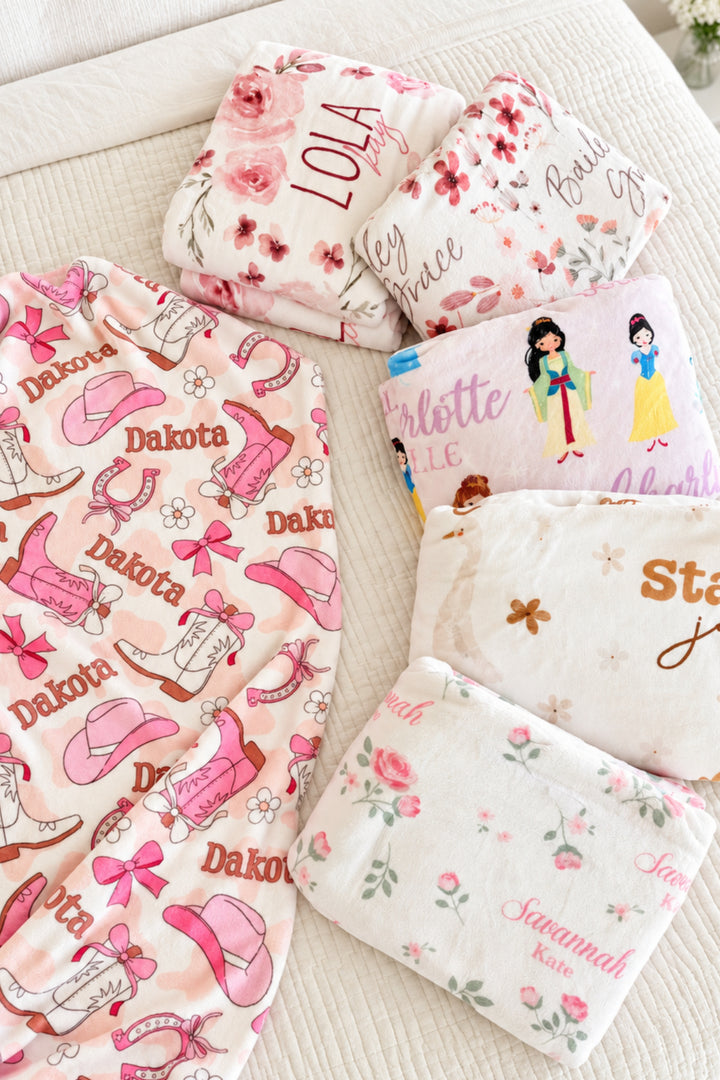 Group image of 5 personalzied Caden Lane girls themed blankets.