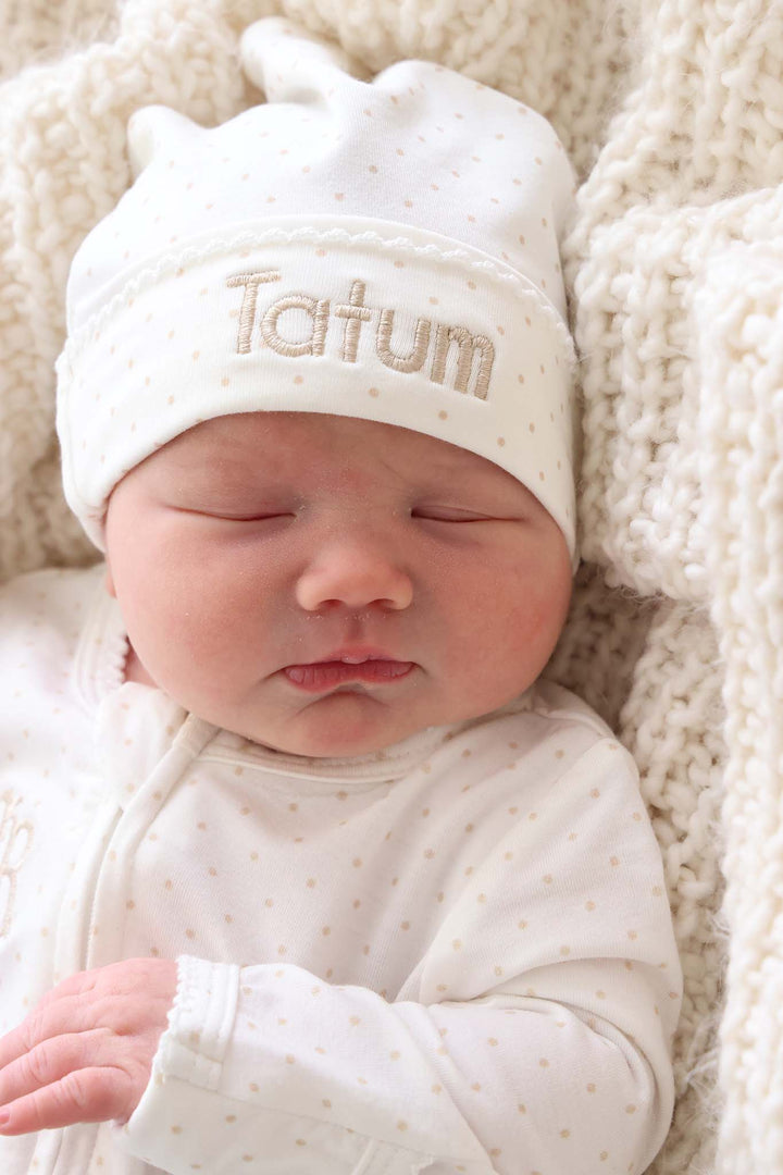 newborn wearing taupe bamboo footie with picot trim