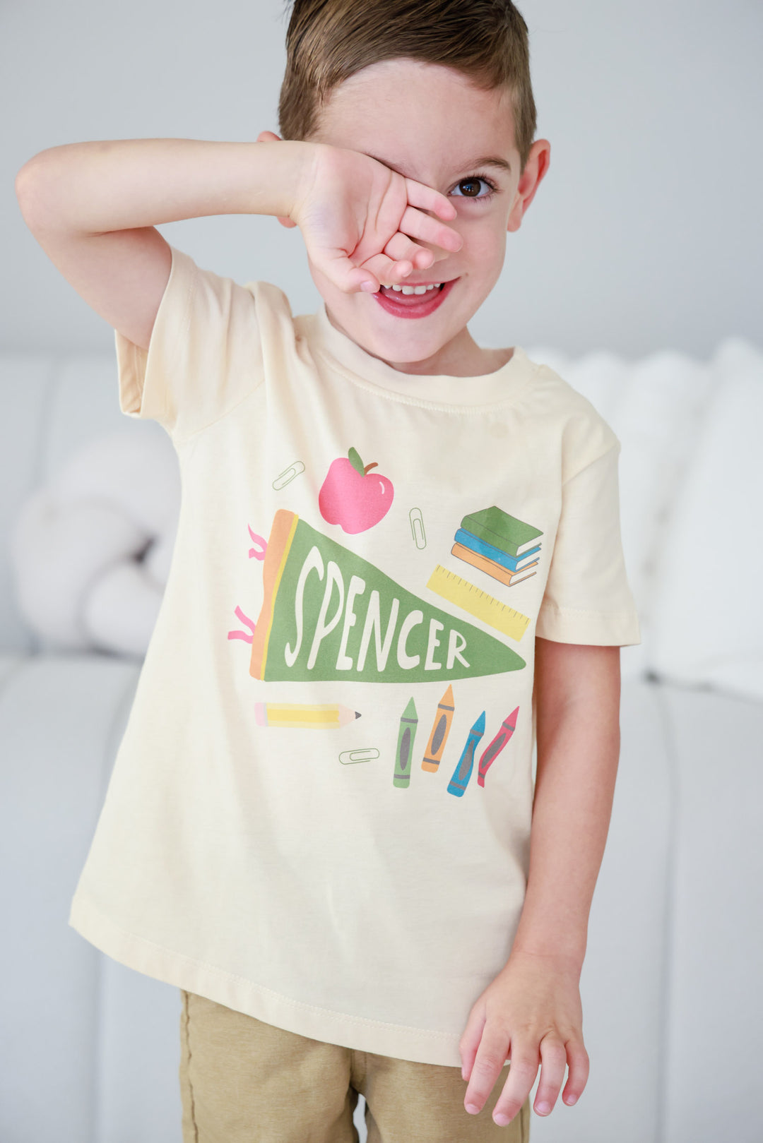 boy wearing personalized flag and school favorites t-shirt