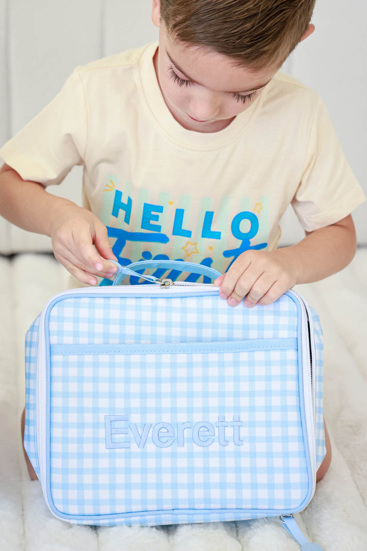 boy unzipping blue gingham embroidered lunchbox