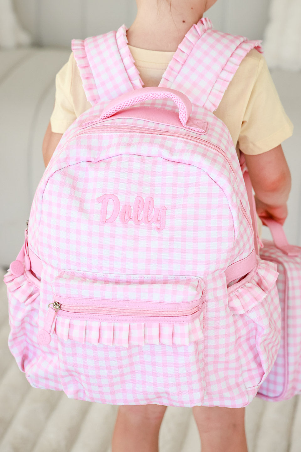back view of embroidered pink gingham backpack for girls 