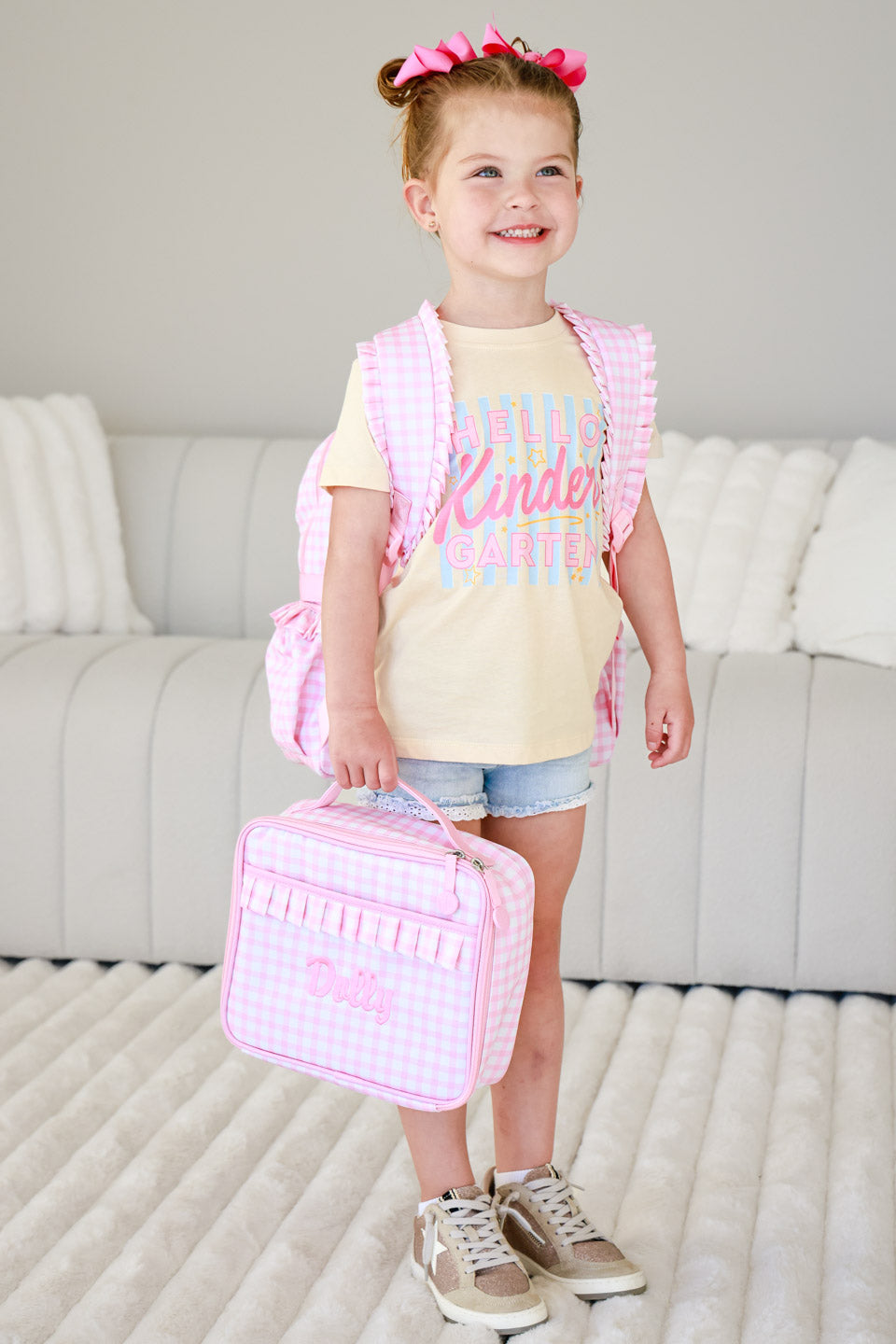 hello kindergarten graphic tee for girls with a pink gingham backpack and lunchbox