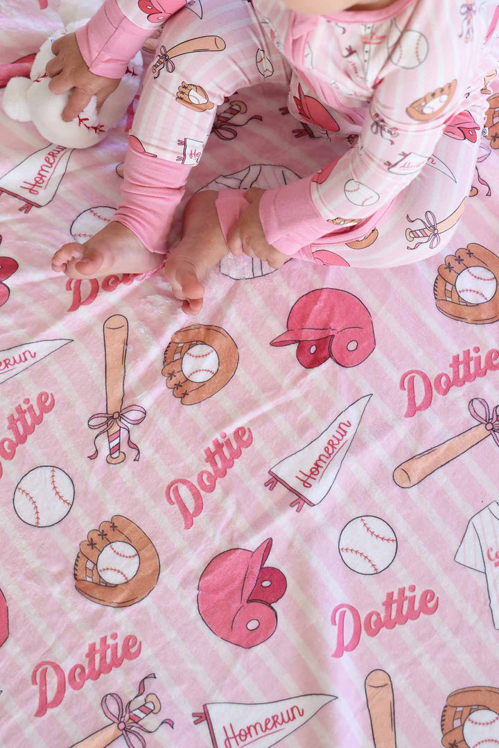 baby girl sitting on ballpark babes personalized blanket 