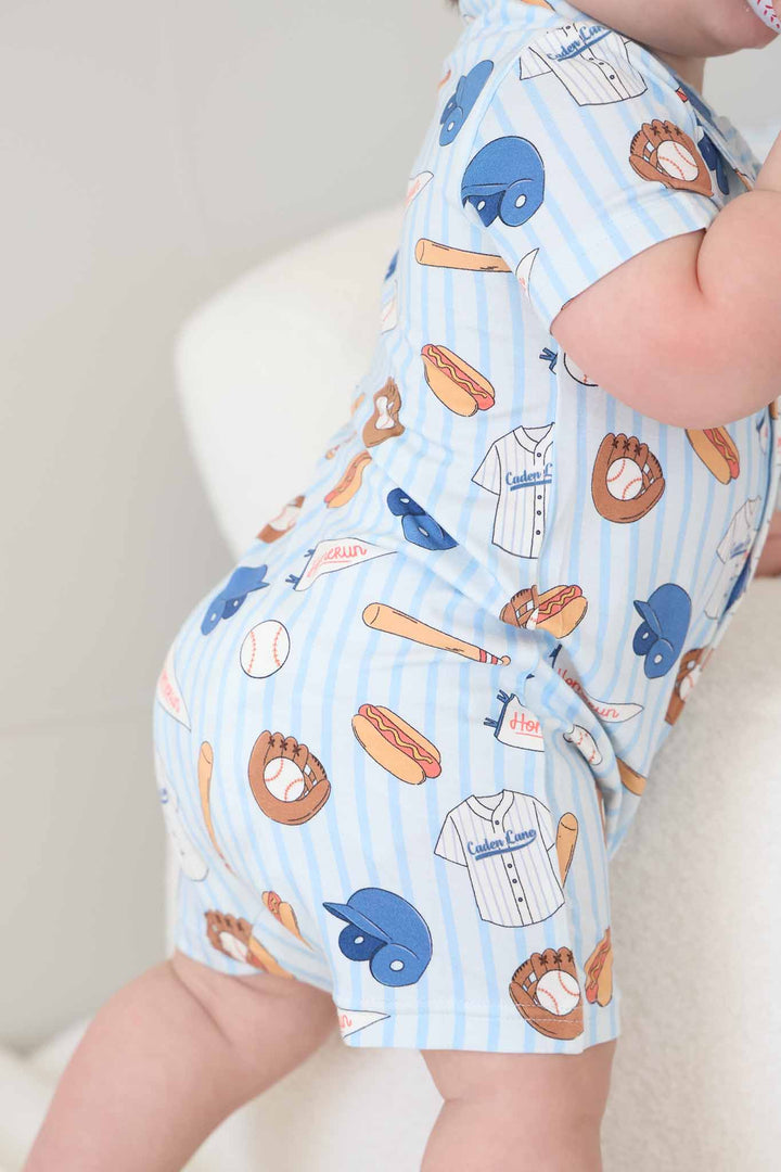 closeup of short sleeve collared shorts romper for baby and toddler boys in ballpark bros print 