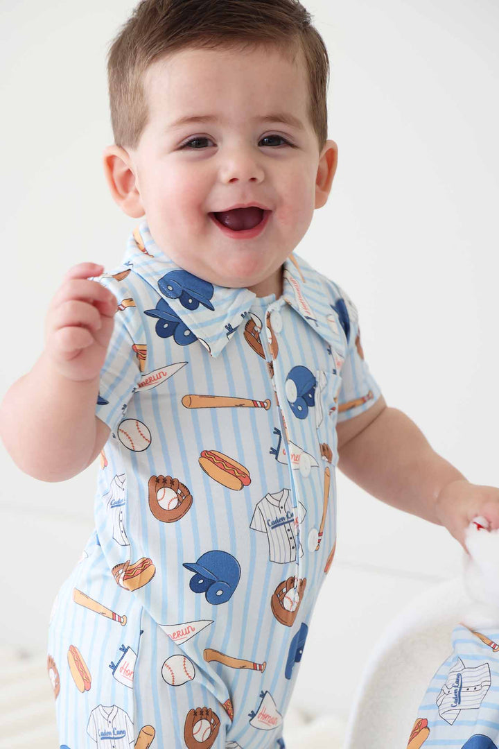 closeup of striped ballpark bros collared button romper for boys 
