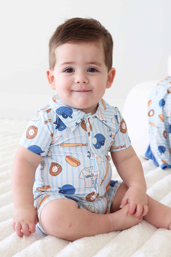 sitting baby boy in ballpark bros collared button romper