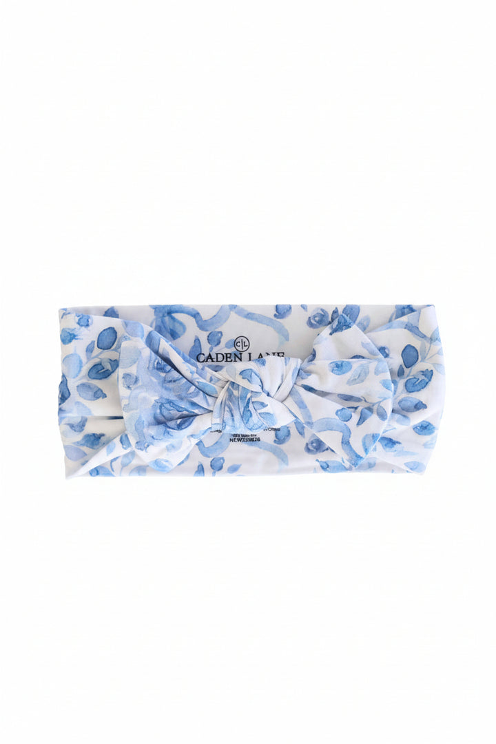 blue and white floral and bow knit bow headwrap for babies 