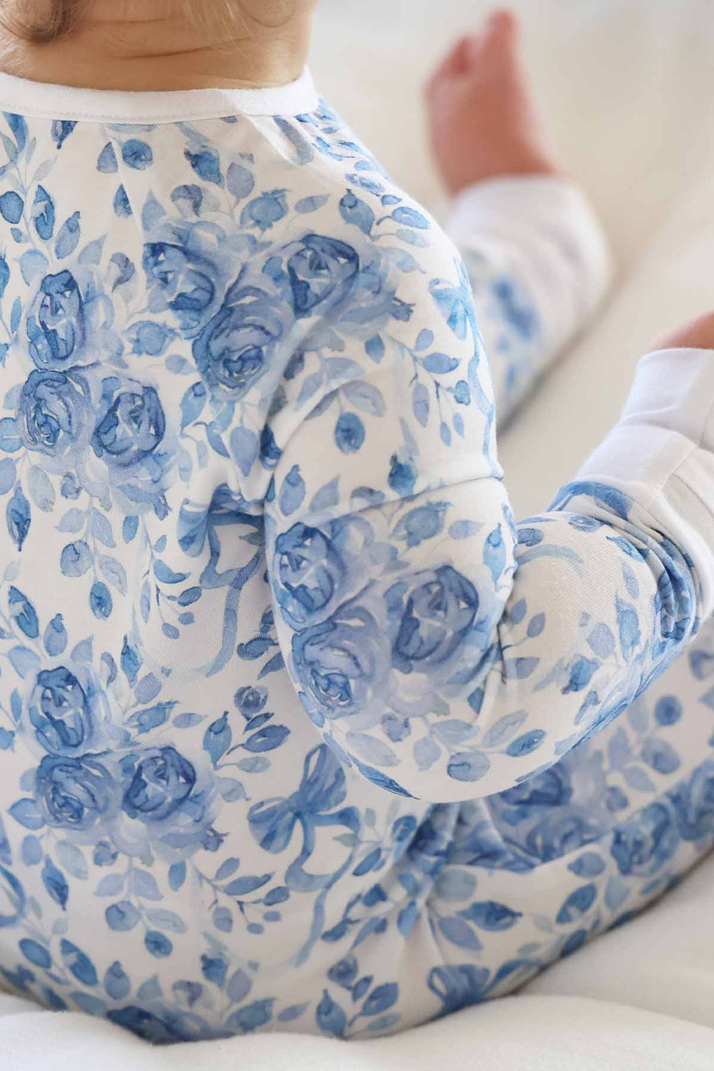 betsy's blooms blue and white rose and ribbon bow printed convertible zip romper pajama for baby and toddler girls 