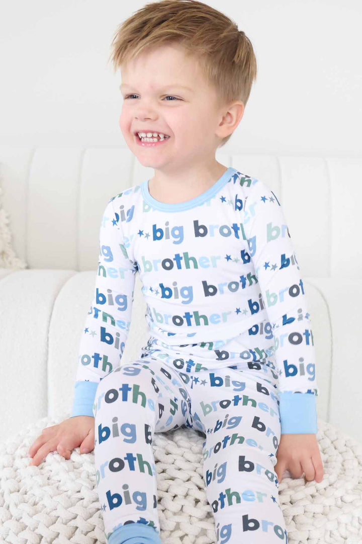 boy wearing big brother two piece pajama set
