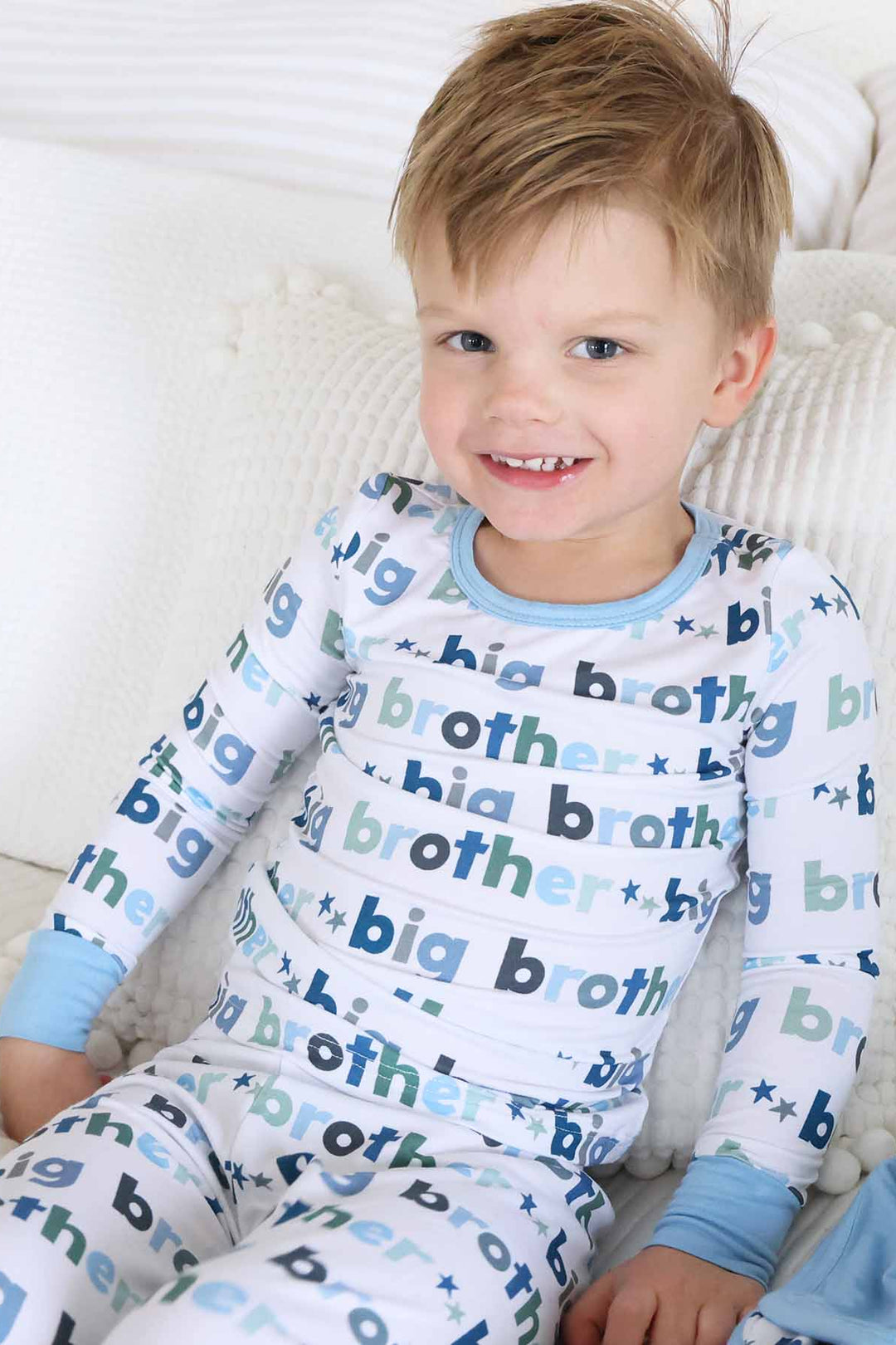 boy wearing big brother two piece pajama set