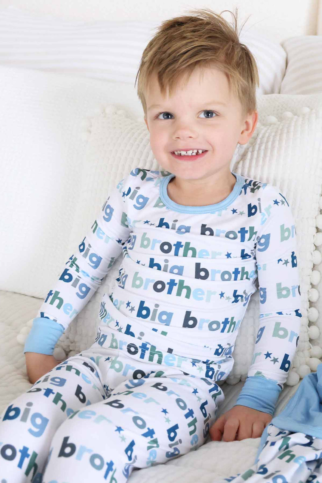 boy wearing big brother two piece pajama set