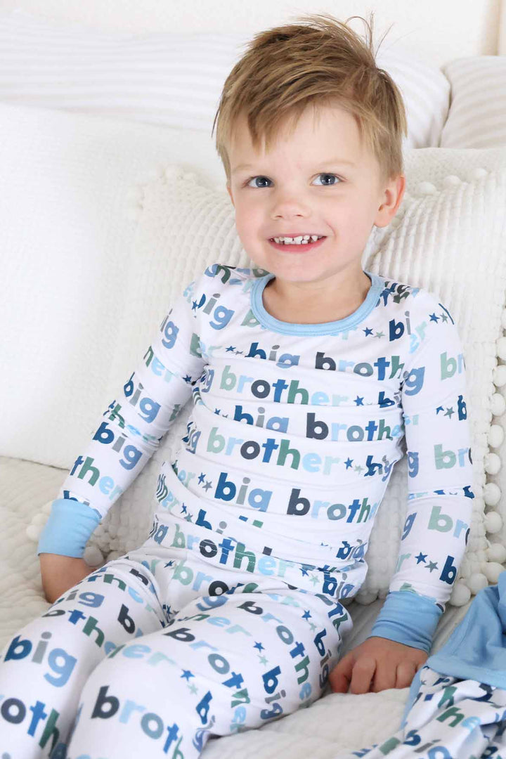 boy wearing big brother two piece pajama set