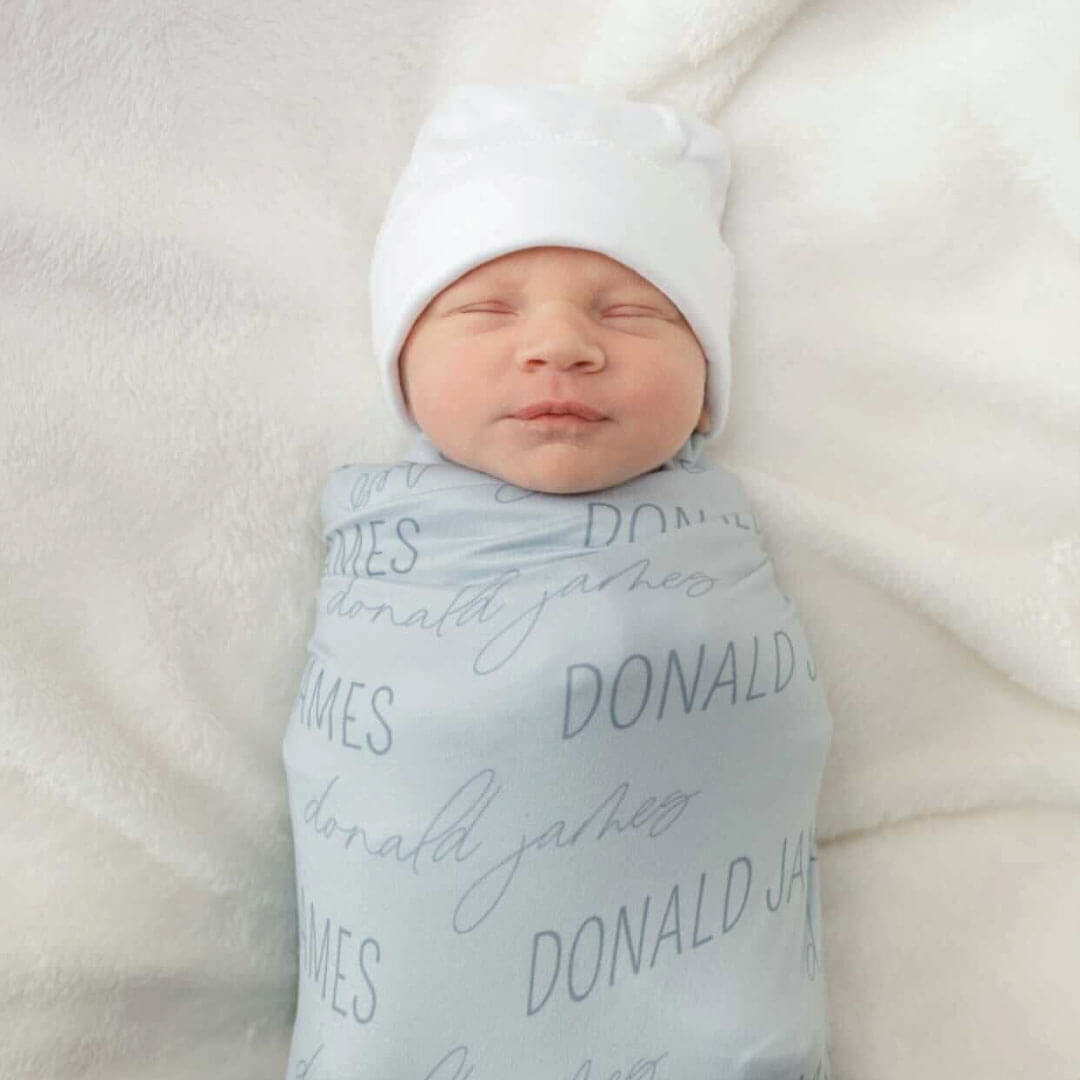 block and script font light blue swaddle